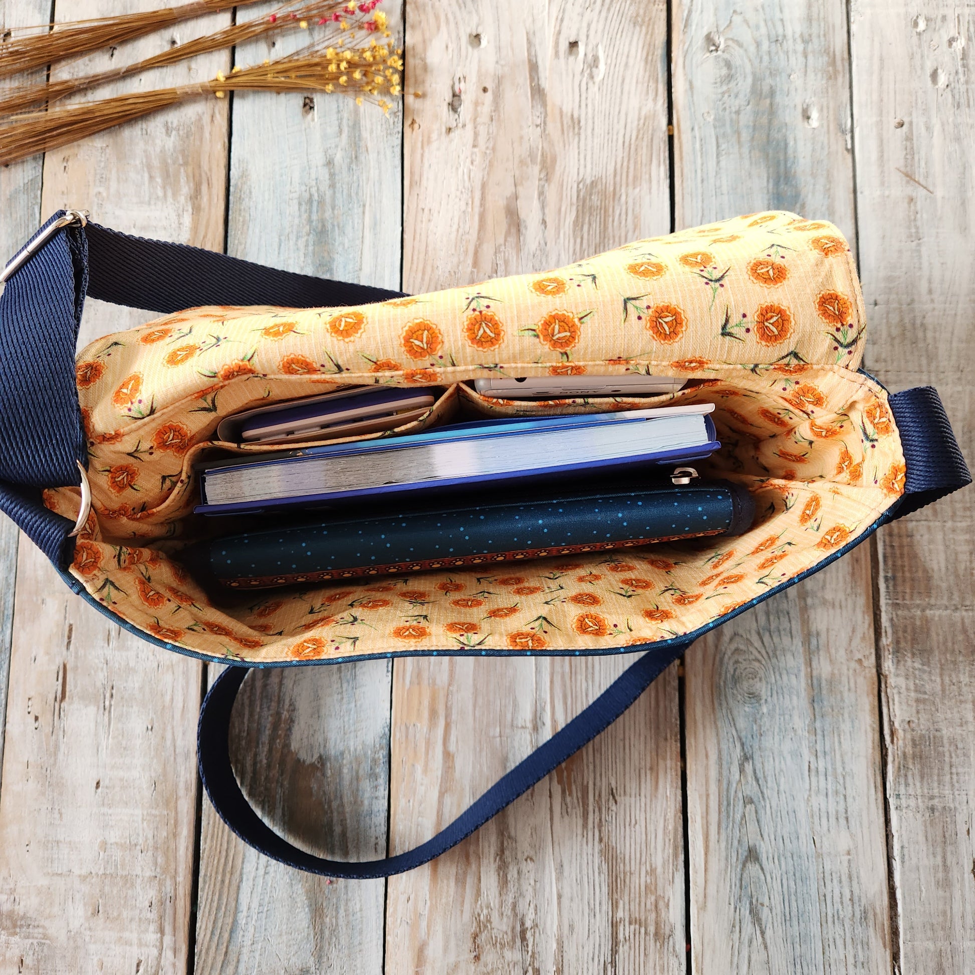 Crossbody bag with cat designs.
